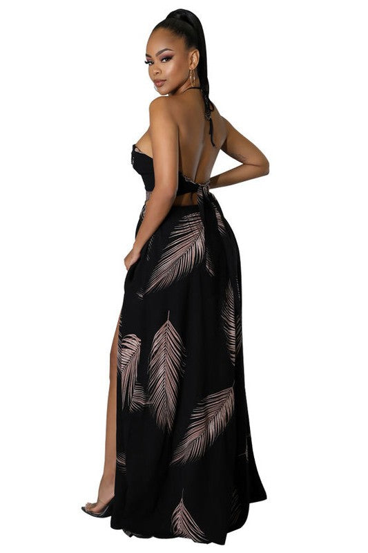 Elegant Halter Neck Maxi Dress featuring a deep neckline, open back, and flowing skirt, perfect for any occasion.