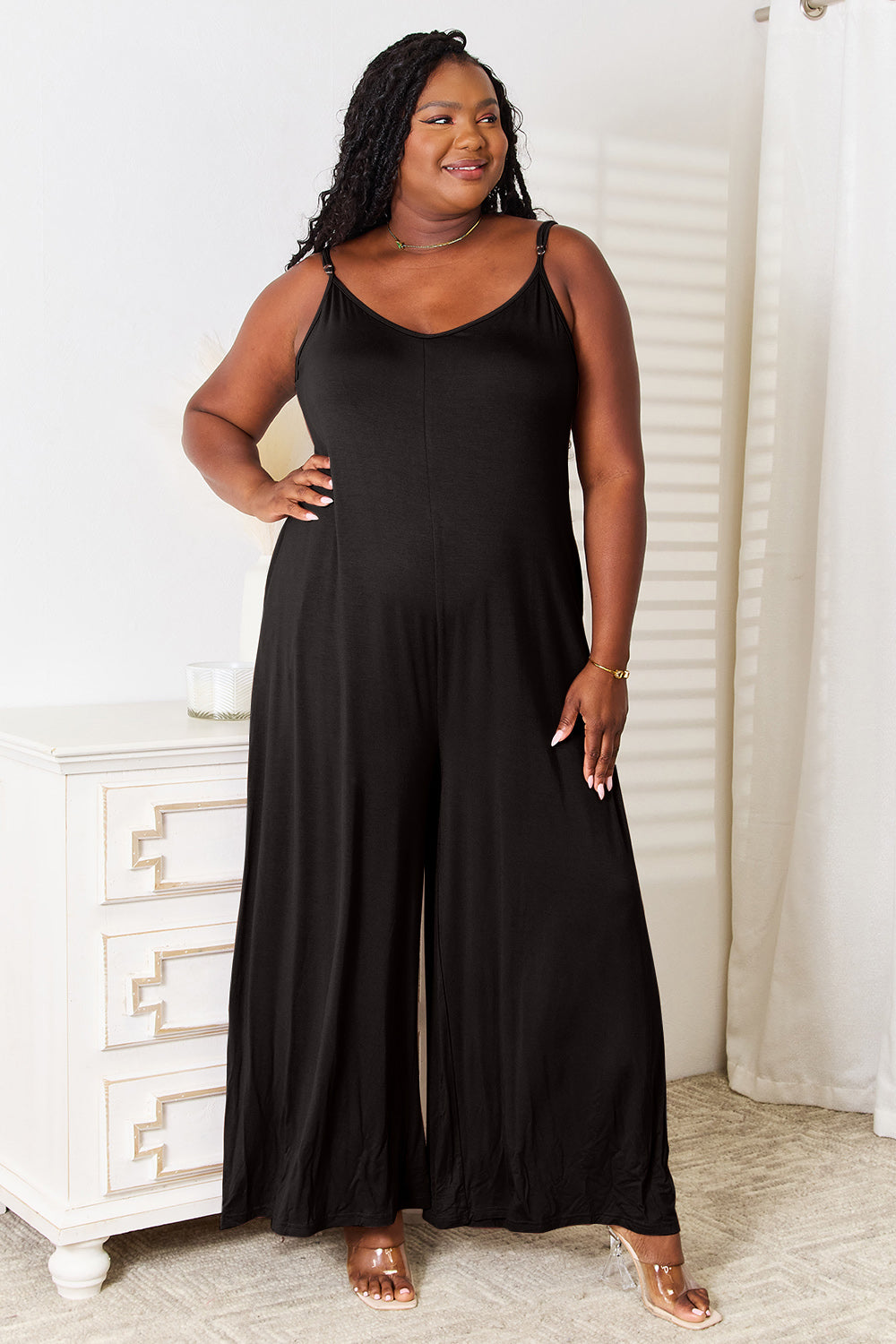 Full Size Soft Rayon Spaghetti Strap Tied Wide Leg Jumpsuit features a trendy silhouette, elegant tied detail, and comfortable wide-leg design.