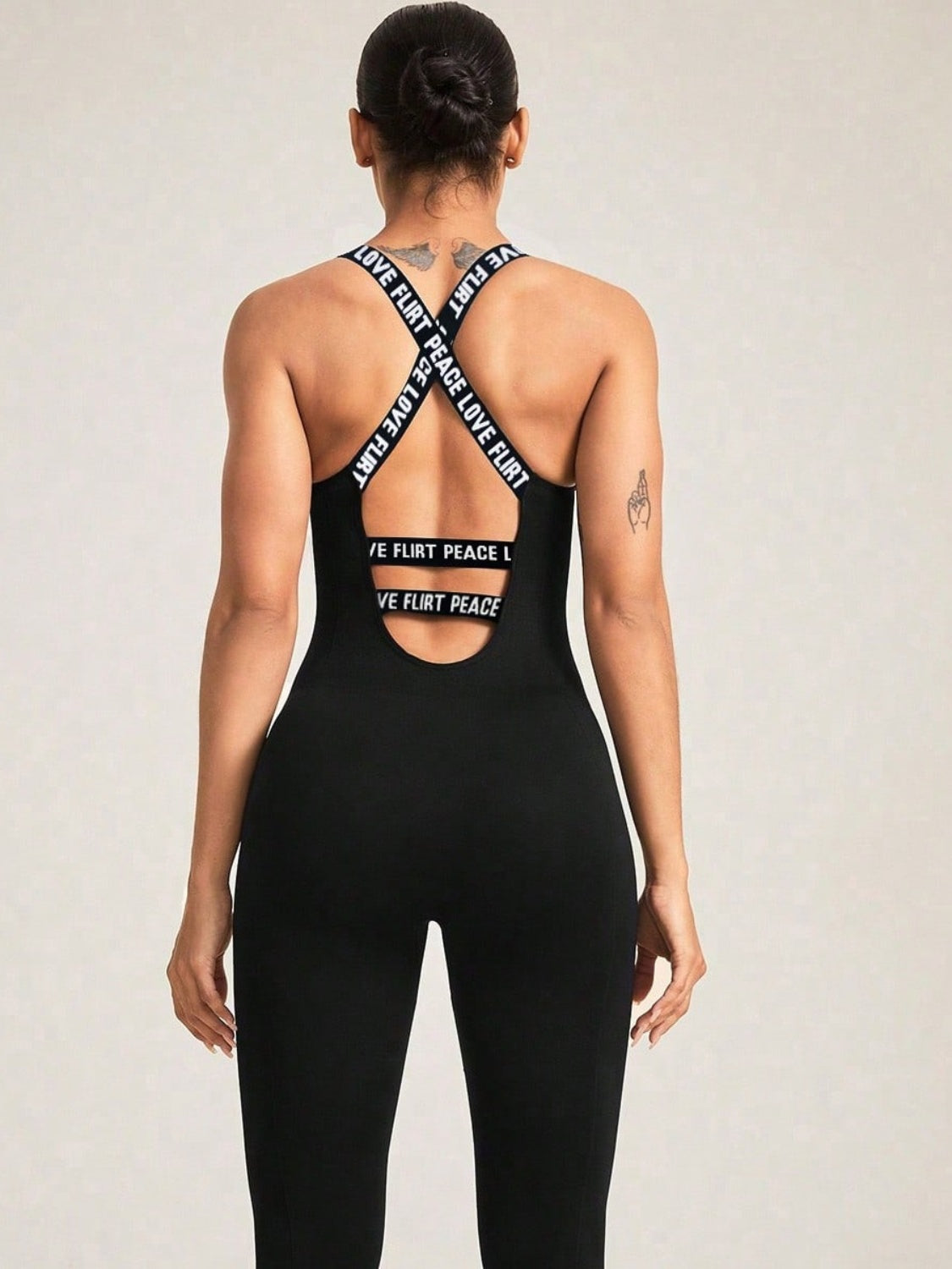 Stylish Crisscross Back Sleeveless Active Jumpsuit features moderate stretch for comfort and a flattering fit.