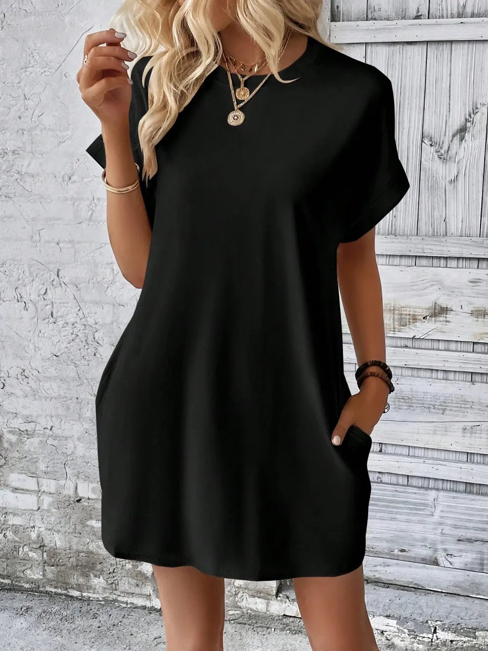 Black woven Round Neck Short Sleeve Mini Dress with a relaxed fit and slight stretch, from Fashion Store, size small.