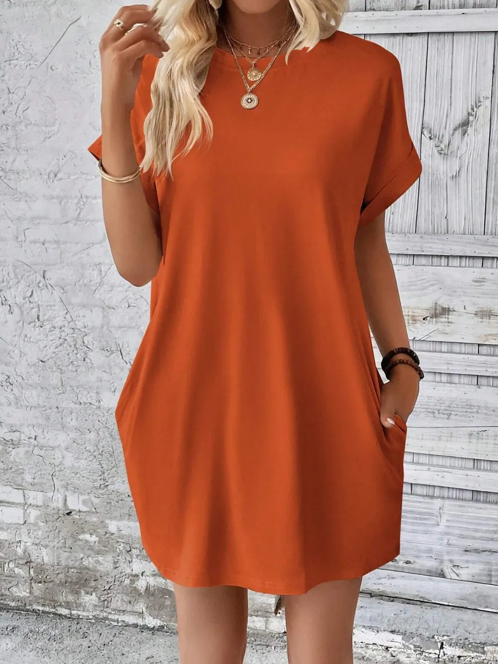 Slightly stretchy, opaque beige round neck short sleeve mini dress with basic style, perfect for casual or summer wear.