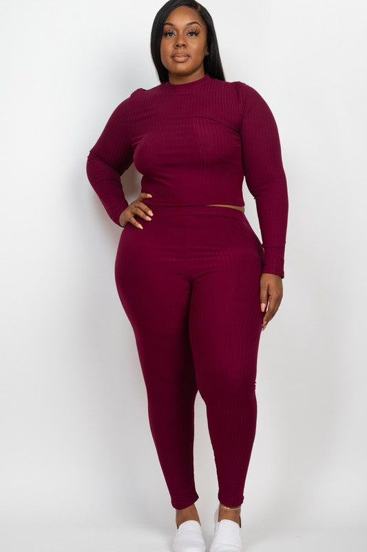 Plus-size model in burgundy ribbed mock-neck long-sleeve top with matching leggings set.