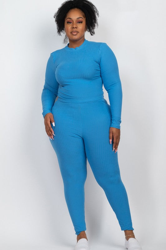 Plus-size model in blue ribbed mock-neck long-sleeve top and matching leggings set.