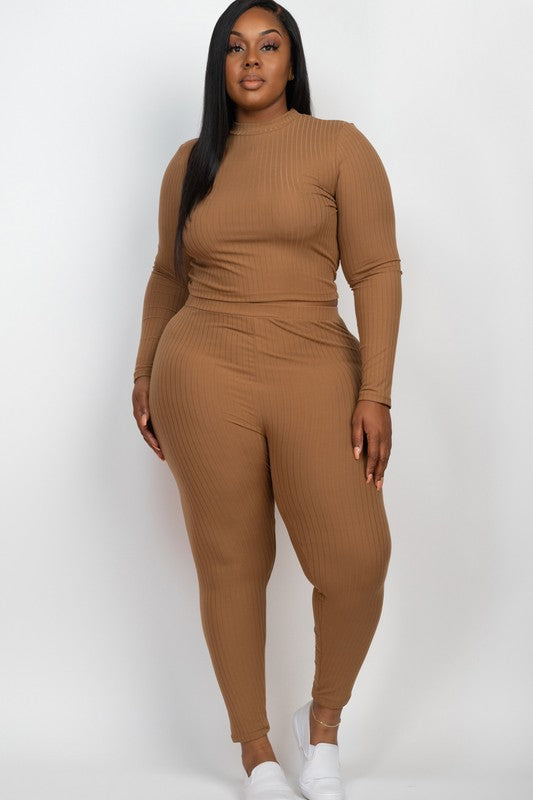 Plus-size woman in tan ribbed mock-neck long-sleeve top with matching leggings, soft stretch fabric, white sneakers.
