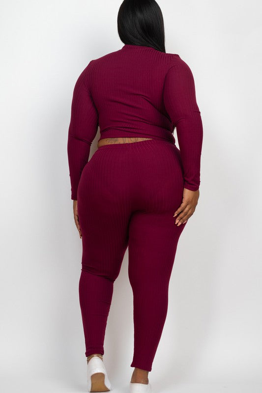 Plus-size woman in burgundy ribbed mock-neck long-sleeve top and matching leggings, back view.