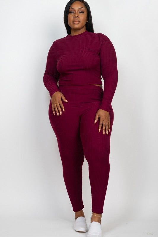 Plus-size burgundy ribbed mock-neck long-sleeve top and matching leggings set on model.