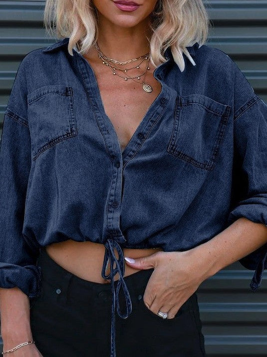 Stylish denim cropped top with button front and drawstring hem, perfect for a chic summer look.