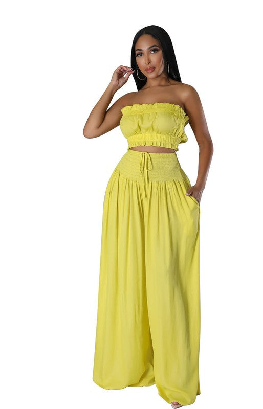 Stylish FASHION WOMEN TWO PIECE SET featuring a bralette and high waist wide-leg pants in vibrant yellow.