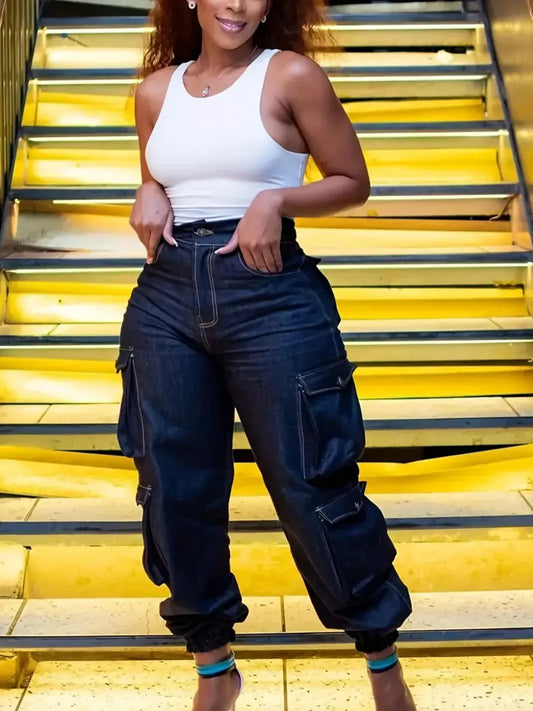 Curvy fit dark denim cargo pants featuring side pockets and elastic cuffs, designed for comfort and a flattering silhouette.