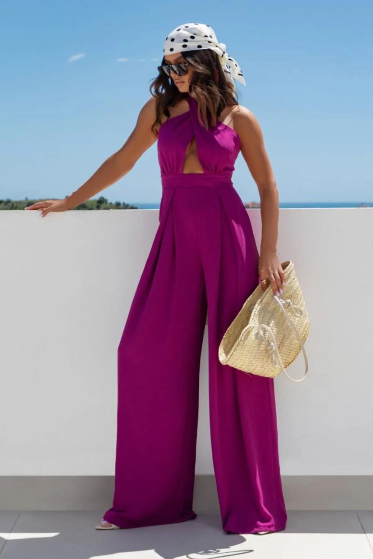 Stylish Halter Neck Wide Leg Jumpsuit with Keyhole Detail featuring cutout backless design, perfect for summer.