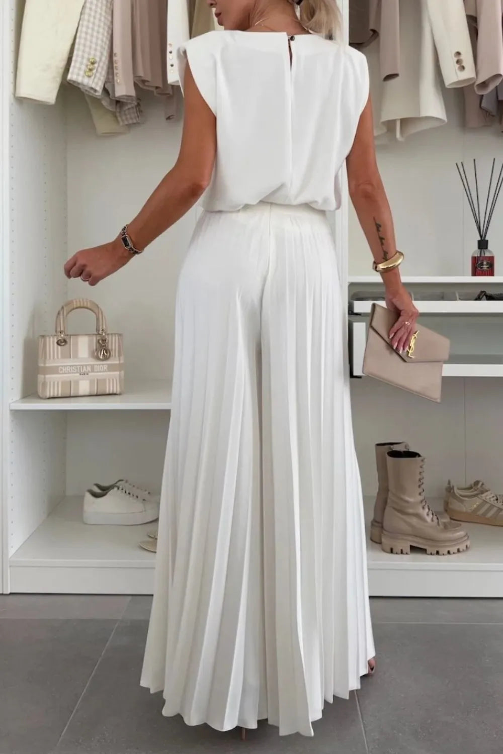Stylish Round Neck Top and Pleated Pants Set in white, perfect for chic, effortless looks. Ideal for any occasion.